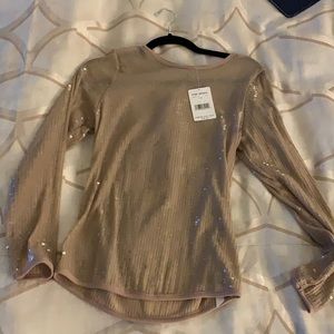 Sequin going out top. Tan. Medium